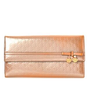 GUCCI 
Patent Microguccissima Bow Heart Continental Wallet Pink